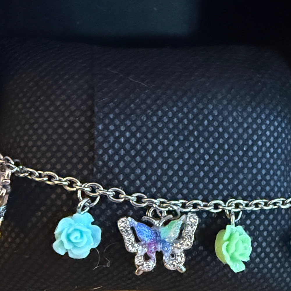Charming Silver Butterfly Bracelet with Floral Accents